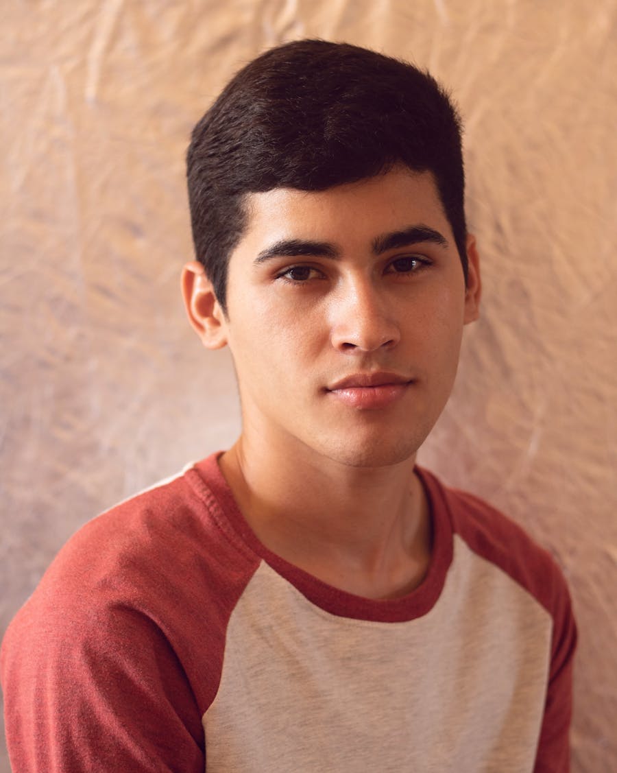 Front-facing sample portrait of a young man in black and white